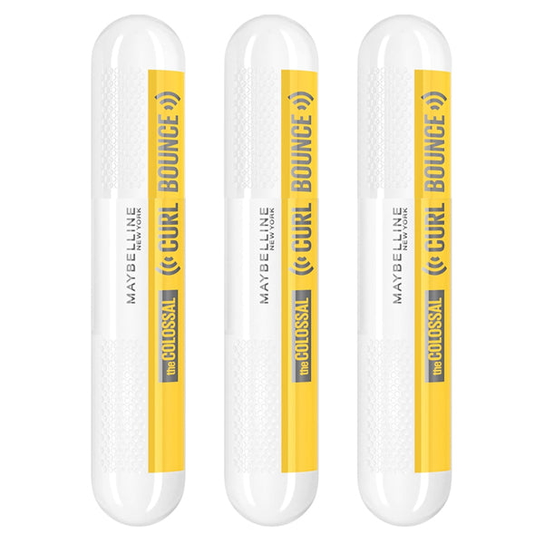 Three Maybelline Volum Express Colossal Curl Bounce Mascara Blackest Black tubes are displayed upright, showcasing this volumizing, long-wearing mascara by Maybelline with a curling effect.